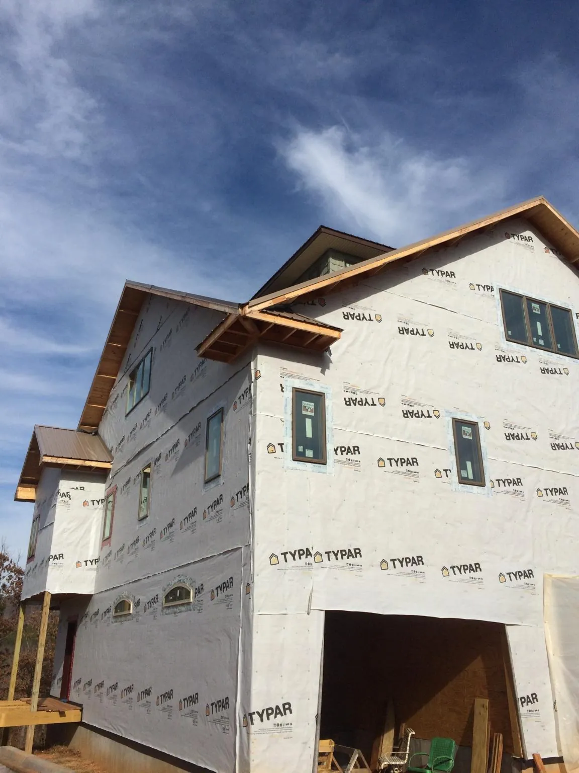 Stick built house wrapped in Typar with new roof framing and dormers in Mongo